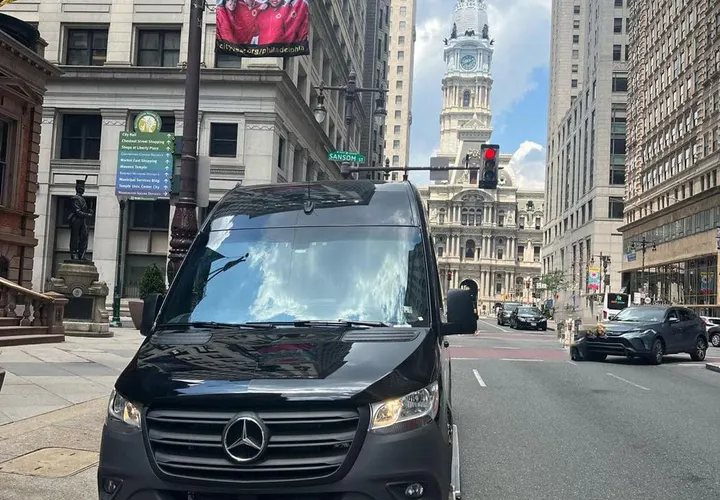 The Royal Limousine Mercedes-Benz Sprinter on a Philadelphia street with City Hall in the background